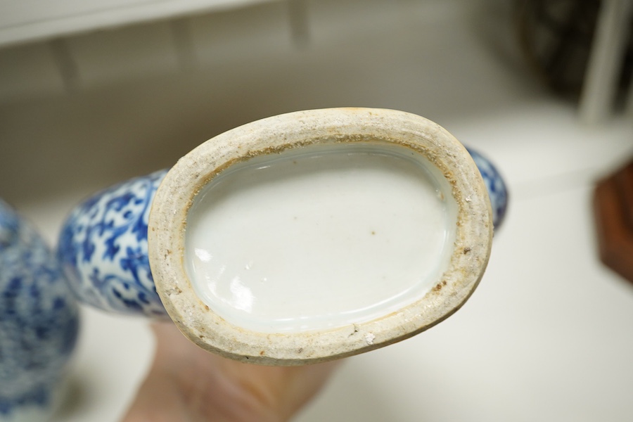 A pair of late 19th century Chinese blue and white moon vases, 23cm. Condition - one vase poor